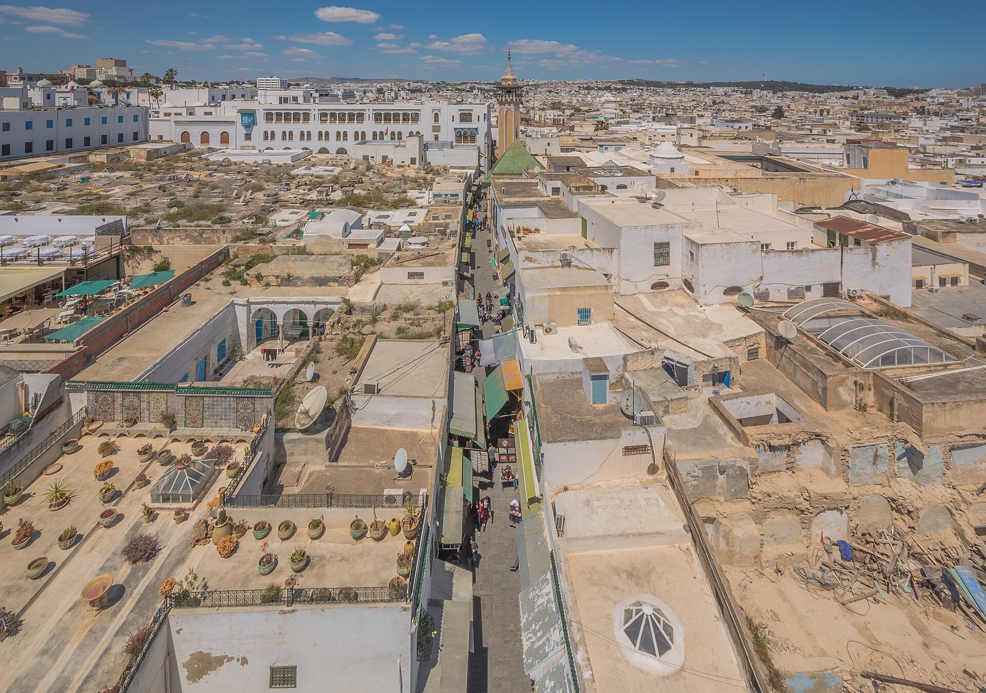 Flat rooftops of the Medina of Tunis seen from above, with a narrow street running between them.